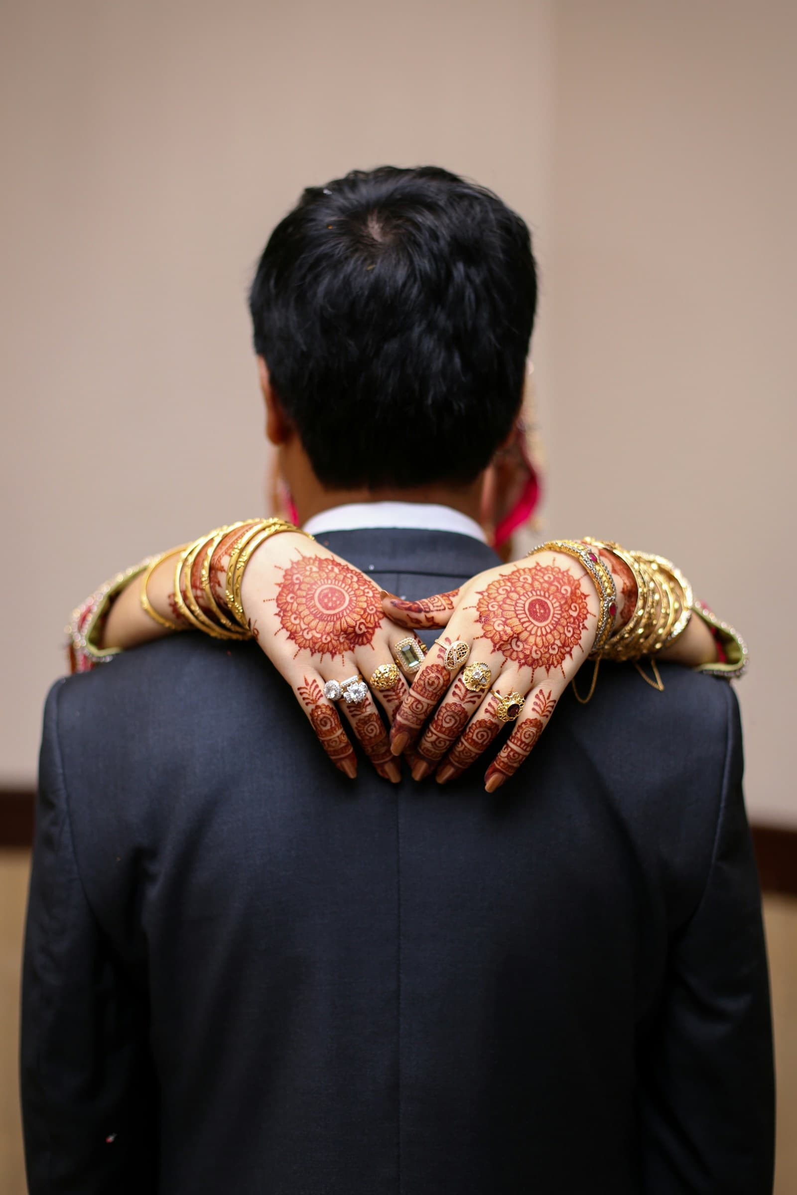 Hands decorated with intricate mehndi henna