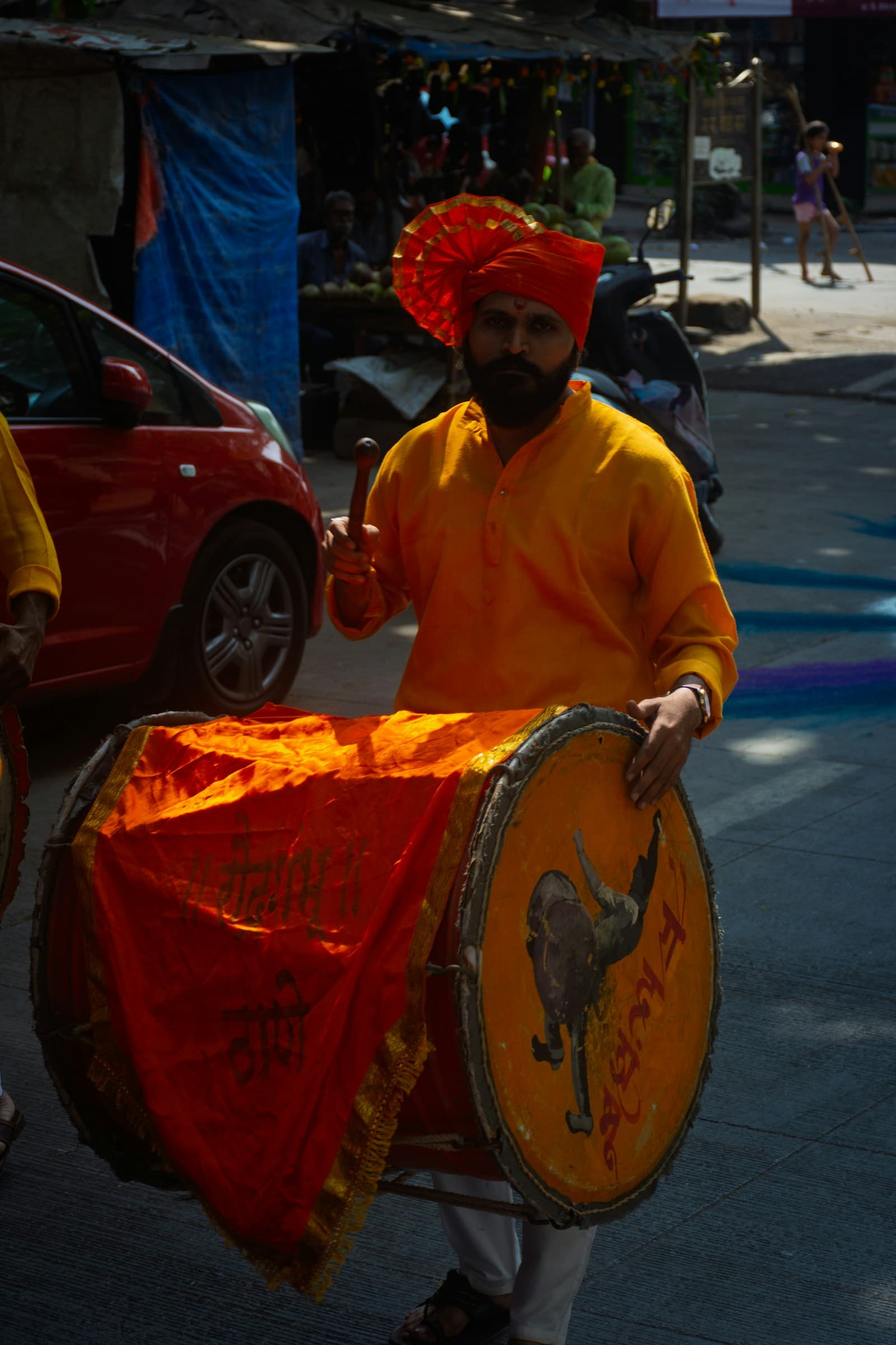 Dhol drummer performing at a baraat